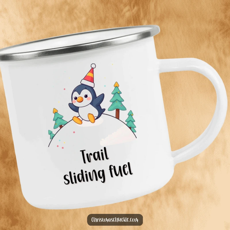 Funny camping mug with a cheerful penguin wearing a clown nose, joyfully sliding down a festive hill, perfect for outdoor fun.