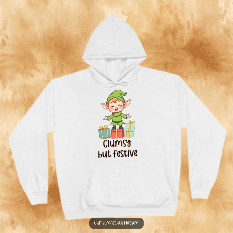 Funny clumsy elf character balancing presents, printed on a cozy hoodie, offering warmth and a touch of holiday hilarity.