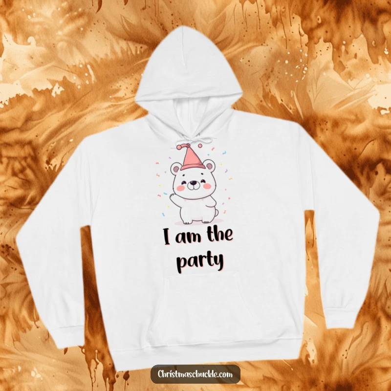 Funny hoodie showcasing a smiling polar bear character wearing a tiny jester hat and tossing confetti, perfect for festive coziness.