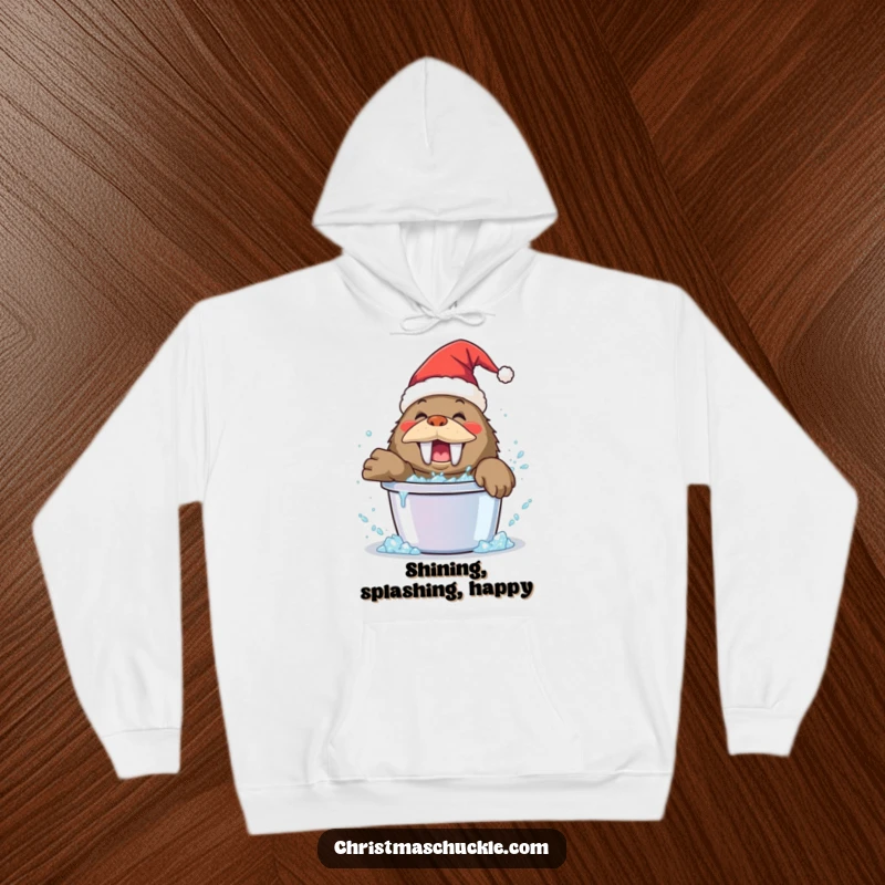 Funny walrus clown hoodie, wearing a Santa hat, playfully splashing in a bucket of glitter, warm and festive apparel.