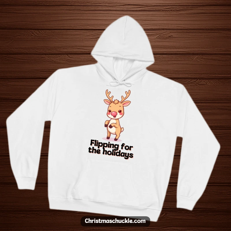 Funny hoodie featuring a cute kawaii reindeer with a tiny clown nose, joyfully doing a cartwheel, full of festive fun.
