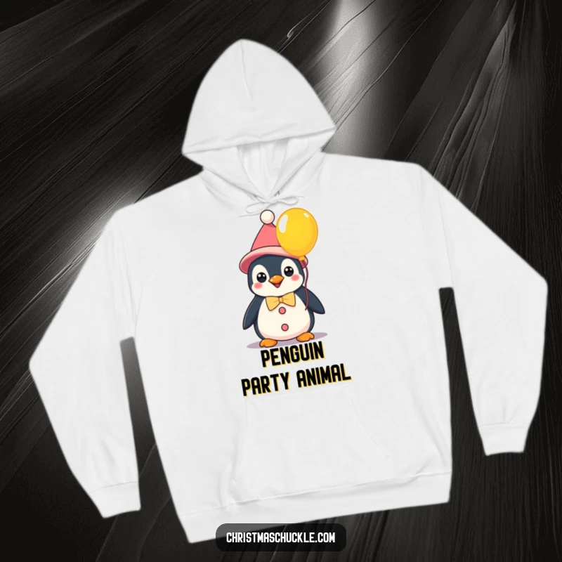 Funny kawaii penguin dressed as a clown holding a colorful balloon, a cozy hoodie perfect for spreading cheerful humor.