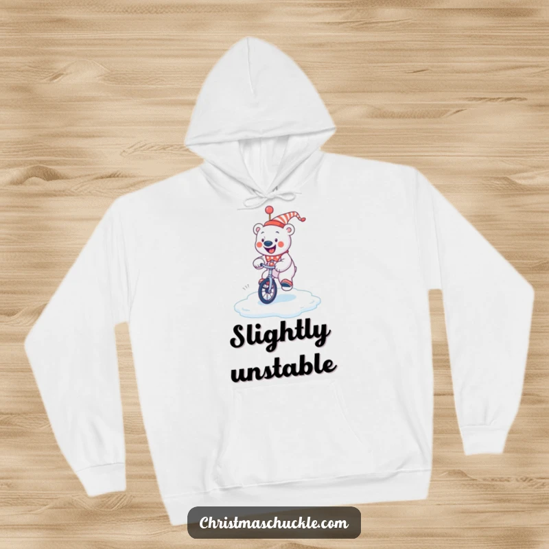 Funny jolly polar bear clown wobbling on a unicycle on a slippery ice surface, a warm and humorous hoodie.