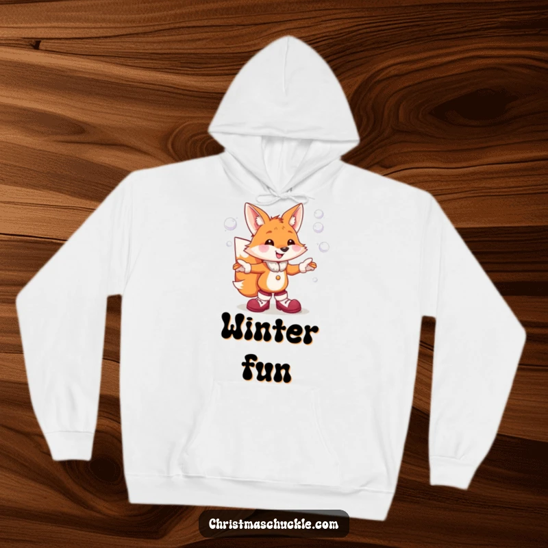 Funny hoodie depicting a joyful fox in oversized clown shoes, humorously juggling multiple snowball projectiles with a wide grin.