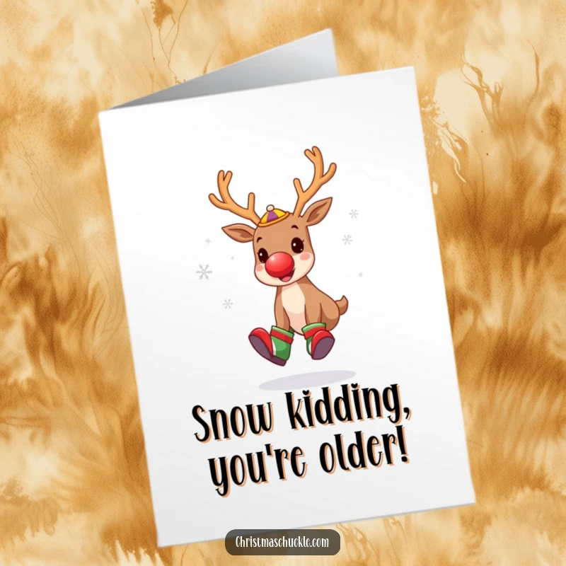 Funny free printable birthday card with a cute reindeer clown juggling snowflakes excitedly.