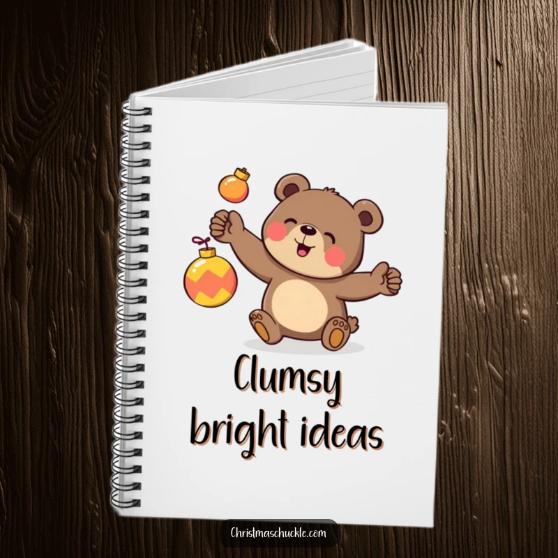 Funny notebook cover with a happy bear character clumsily juggling three brightly colored ornaments, ideal for festive notes.