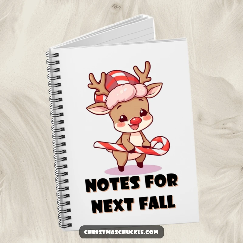 Funny notebook with a happy reindeer in a clown wig, comically tripping over a candy cane, ideal for holiday notes.