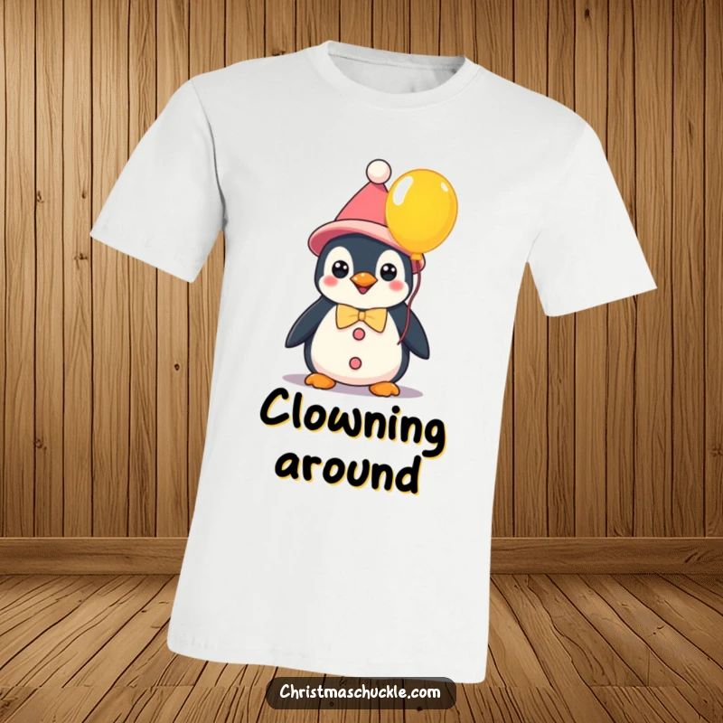 Funny kawaii penguin in clown attire holding a vibrant balloon, a humorous t-shirt celebrating playful characters and fun.