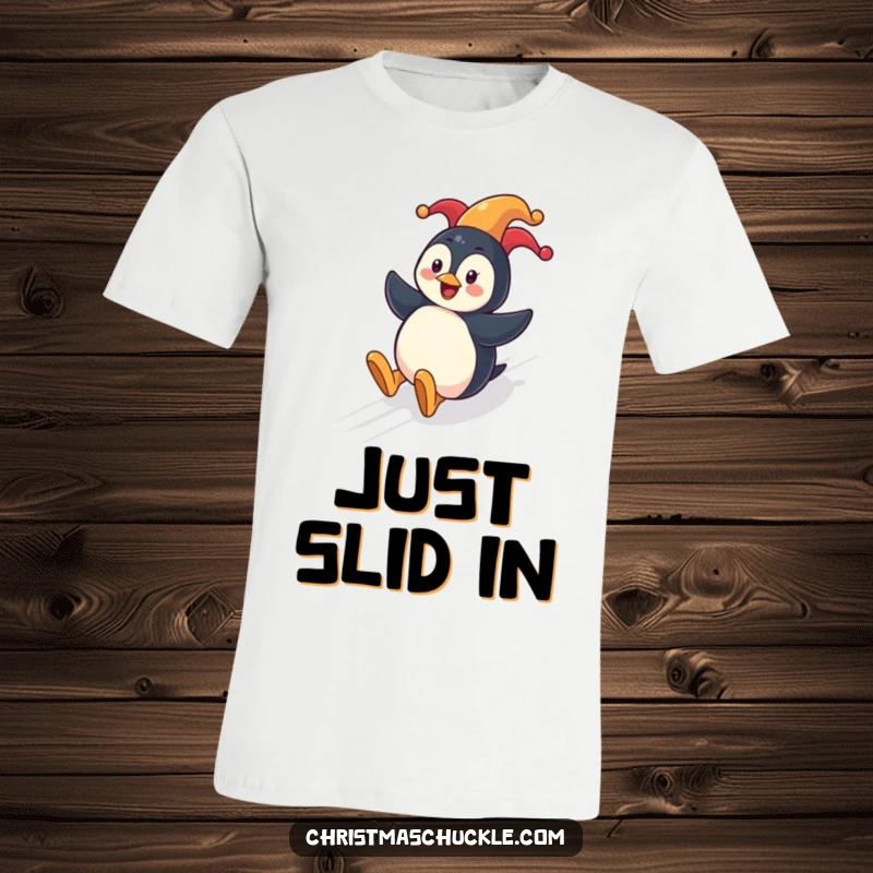 Funny penguin clown t-shirt depicting a cheerful penguin in a clown nose, joyfully sliding down a snowy hill.