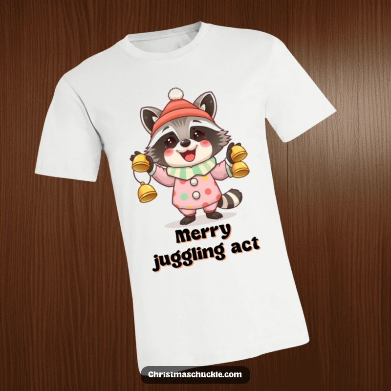 Funny t-shirt showcasing a happy raccoon dressed as a clown, expertly juggling three bright jingle bells.