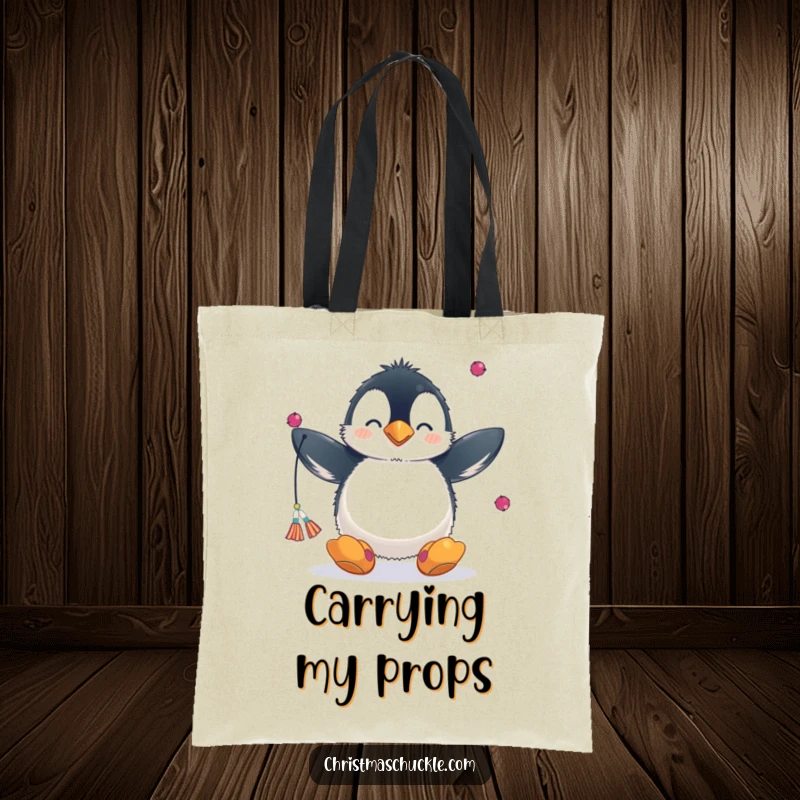 Funny tote bag with a fluffy penguin in a clown nose and big shoes, juggling scarves, perfect for carrying daily items.